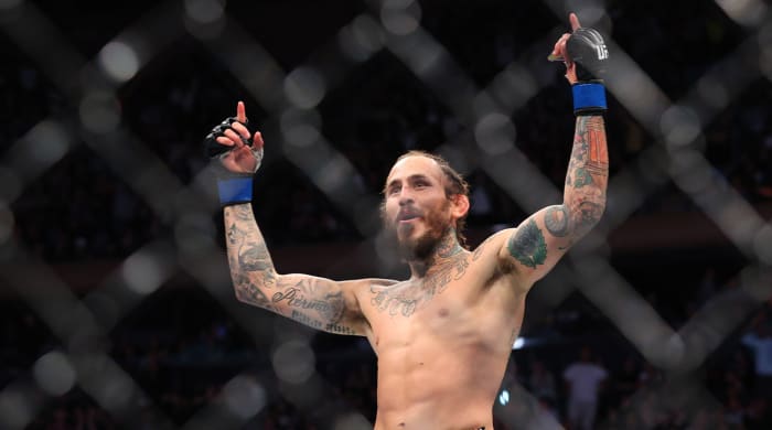 Nov 6, 2021; New York, NY, USA; Marlon Vera (blue gloves) celebrates after defeating Frankie Edgar (red gloves) during UFC 268 at Madison Square Garden.